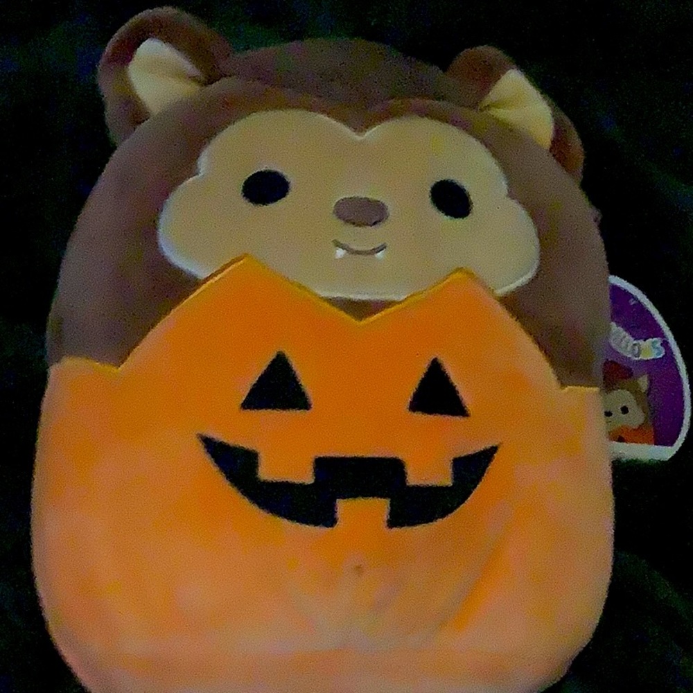 Brown werewolf with orange jack-o’-lantern body
